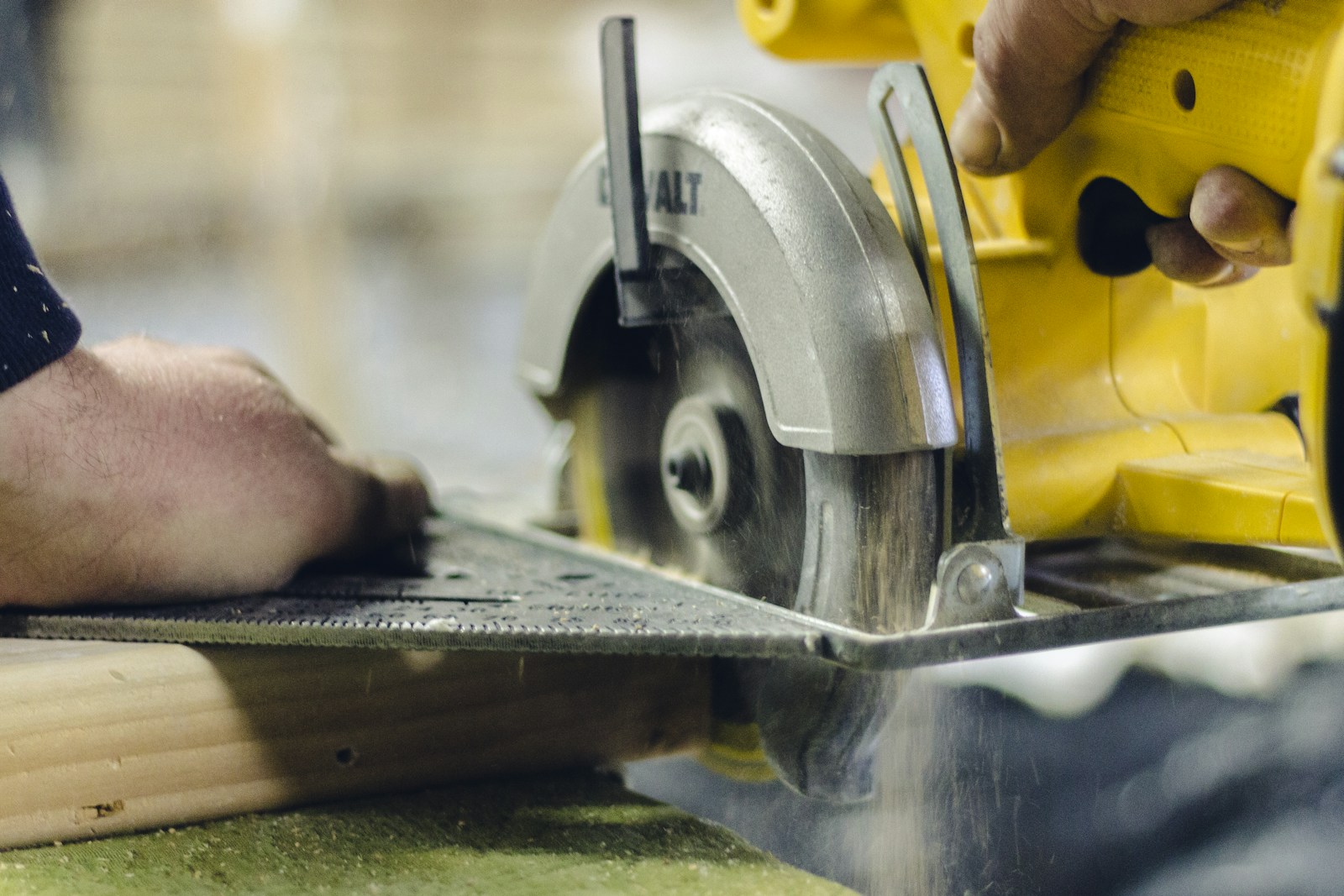 A carpenter using a circular saw to cut lumber